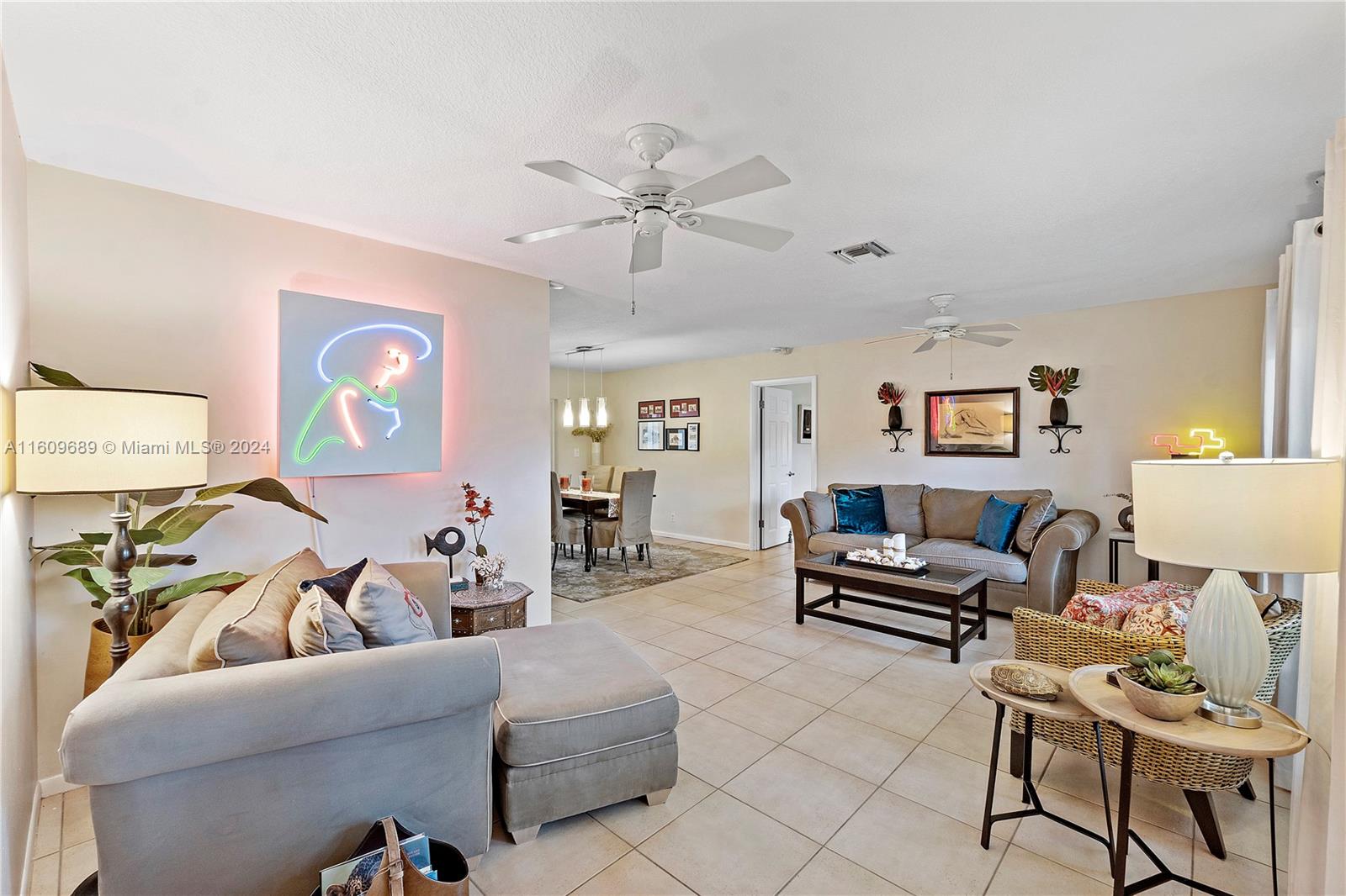 5511 Southwest 196th Lane Southwest Ranches, FL 33332 - Photo 7 of 94 a living room with furniture and a ceiling fan