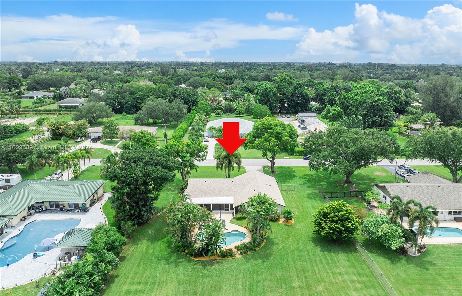 5511 Southwest 196th Lane Southwest Ranches, FL 33332 - Photo 80 of 94 an aerial view of a house with pool outdoor seating and yard