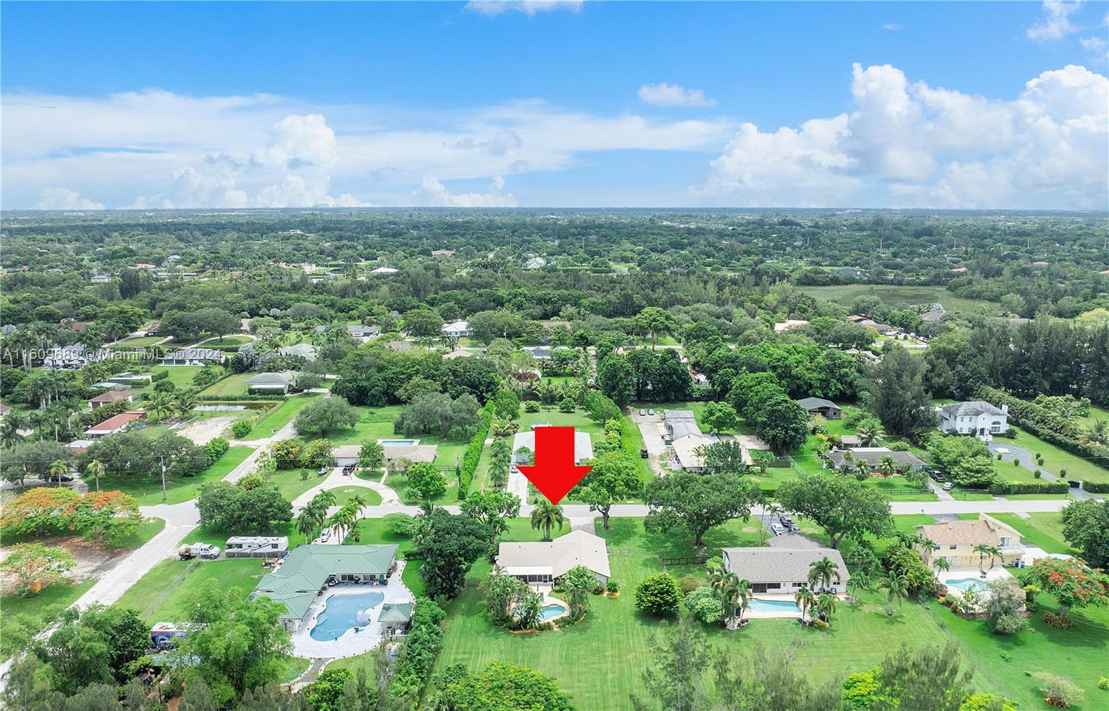 5511 Southwest 196th Lane Southwest Ranches, FL 33332 - Photo 82 of 94 an aerial view of residential houses with outdoor space and trees