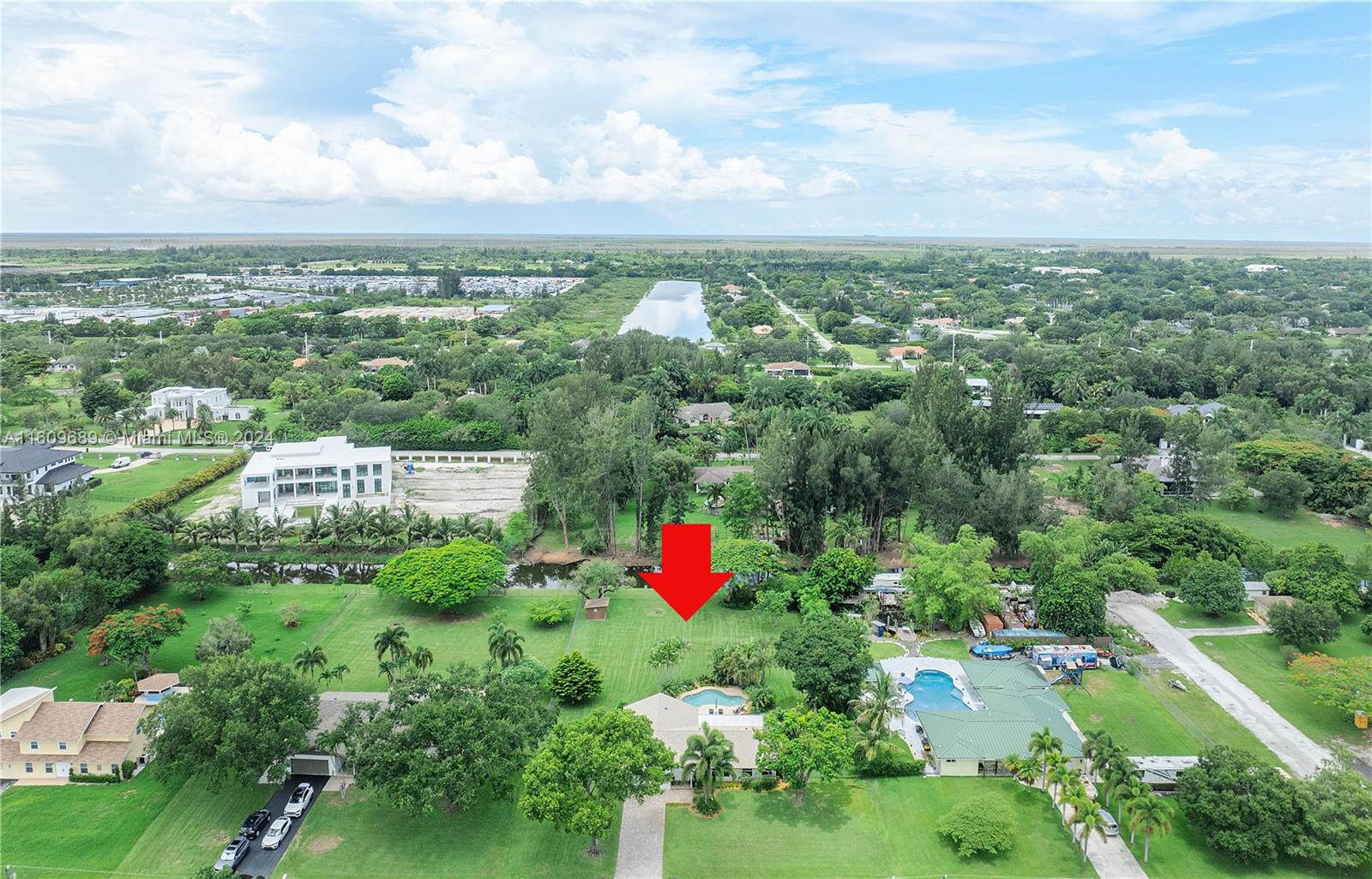 5511 Southwest 196th Lane Southwest Ranches, FL 33332 - Photo 86 of 94 an aerial view of residential houses with outdoor space and trees