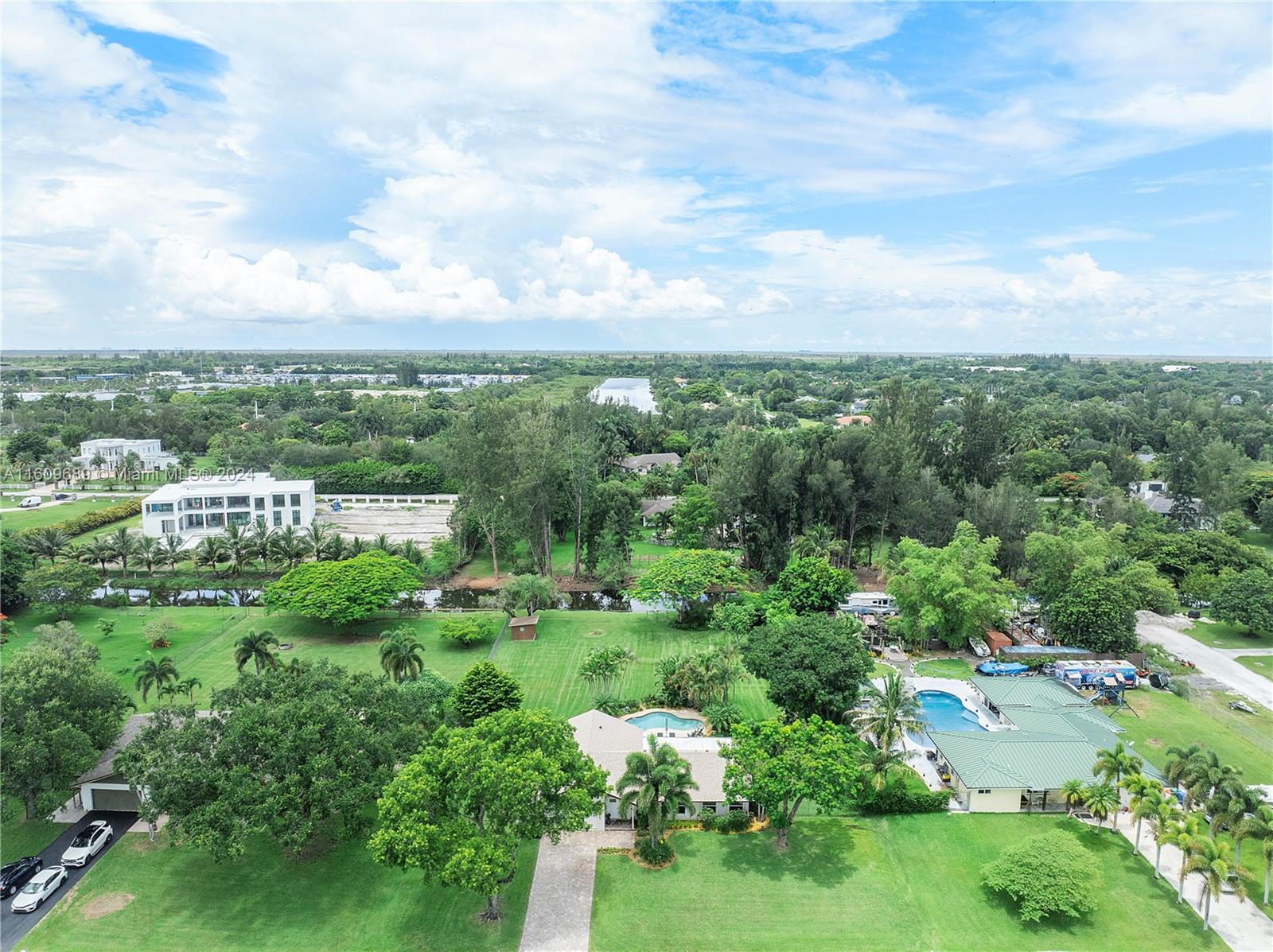 5511 Southwest 196th Lane Southwest Ranches, FL 33332 - Photo 87 of 94 a view of a city with lush green forest