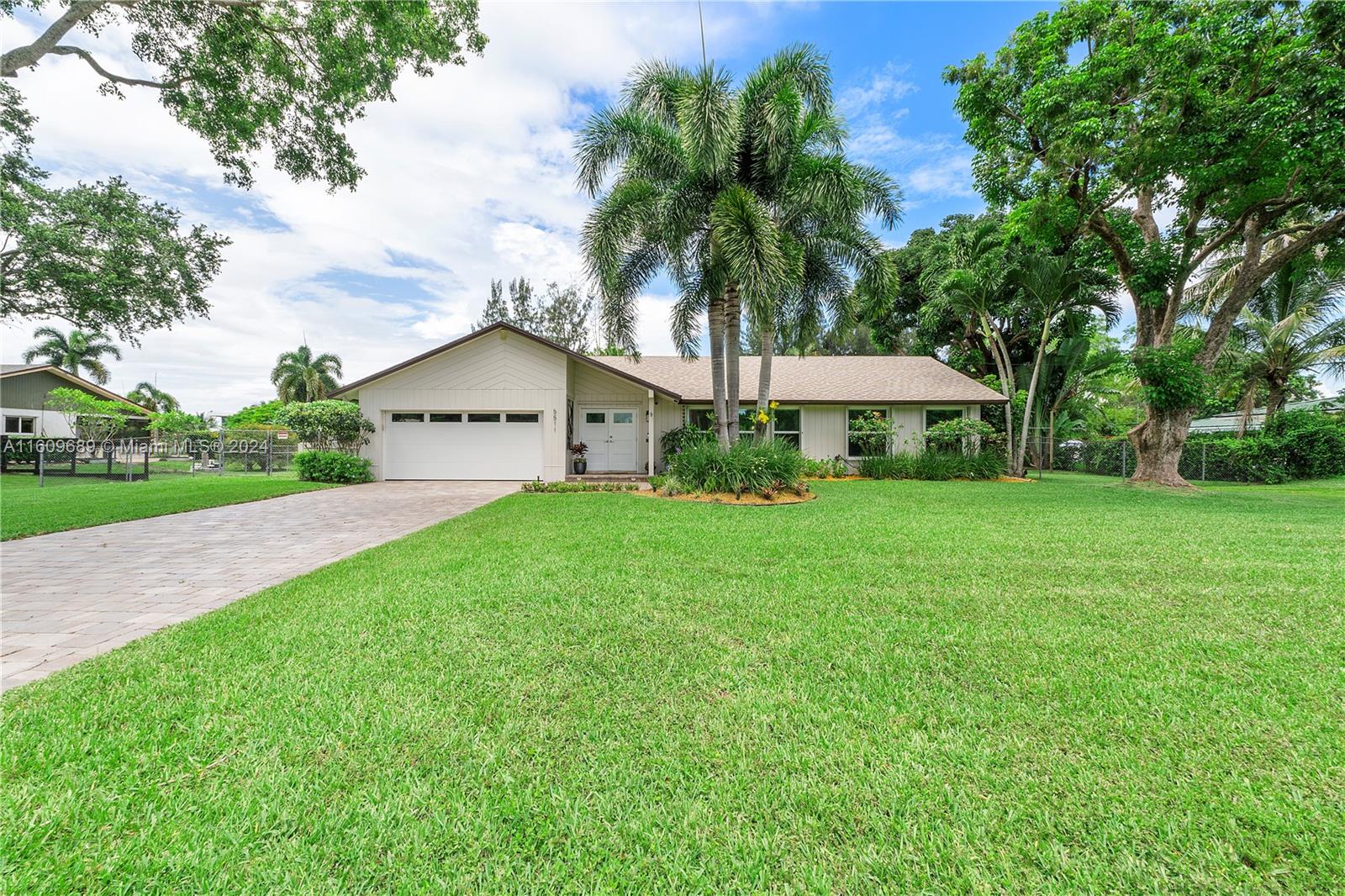 5511 Southwest 196th Lane Southwest Ranches, FL 33332 - Photo 93 of 94 a house view with a garden space