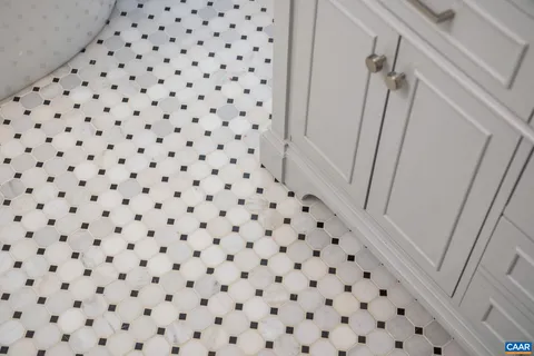 a bathroom with a sink double vanity and a mirror