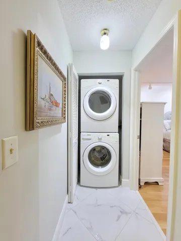 a view of a hallway with washer and dryer