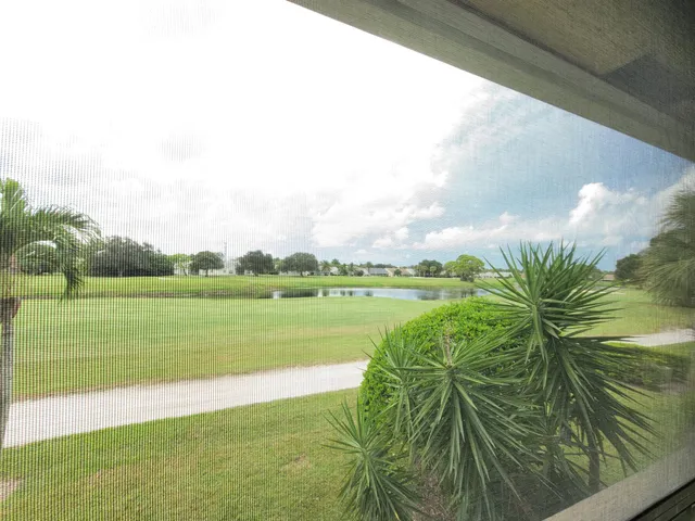 a view of a lake with a big yard