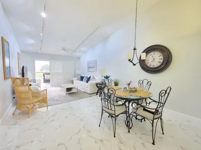 a view of a livingroom with furniture and rug