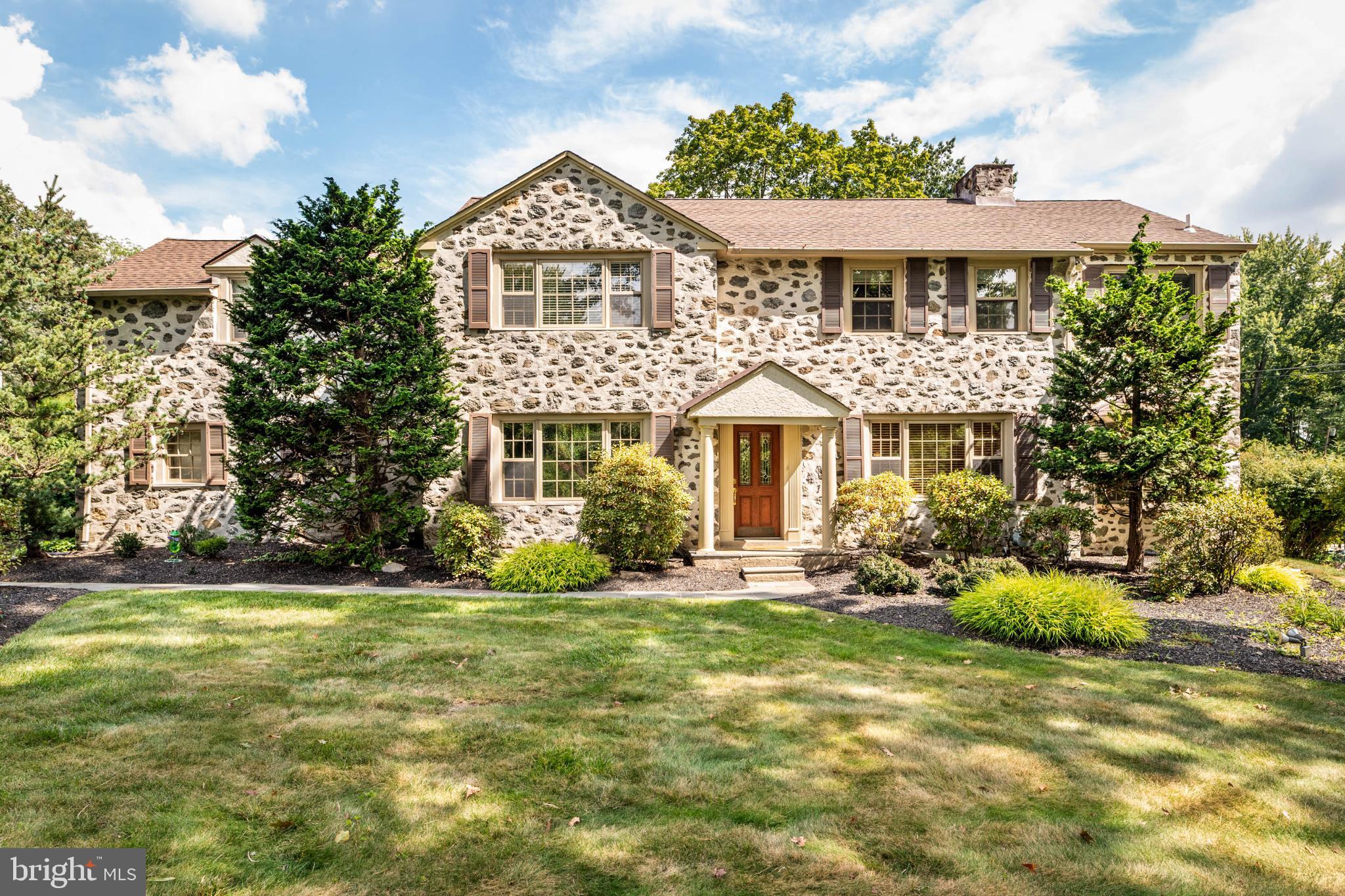 Charming exterior front with field stone facade.