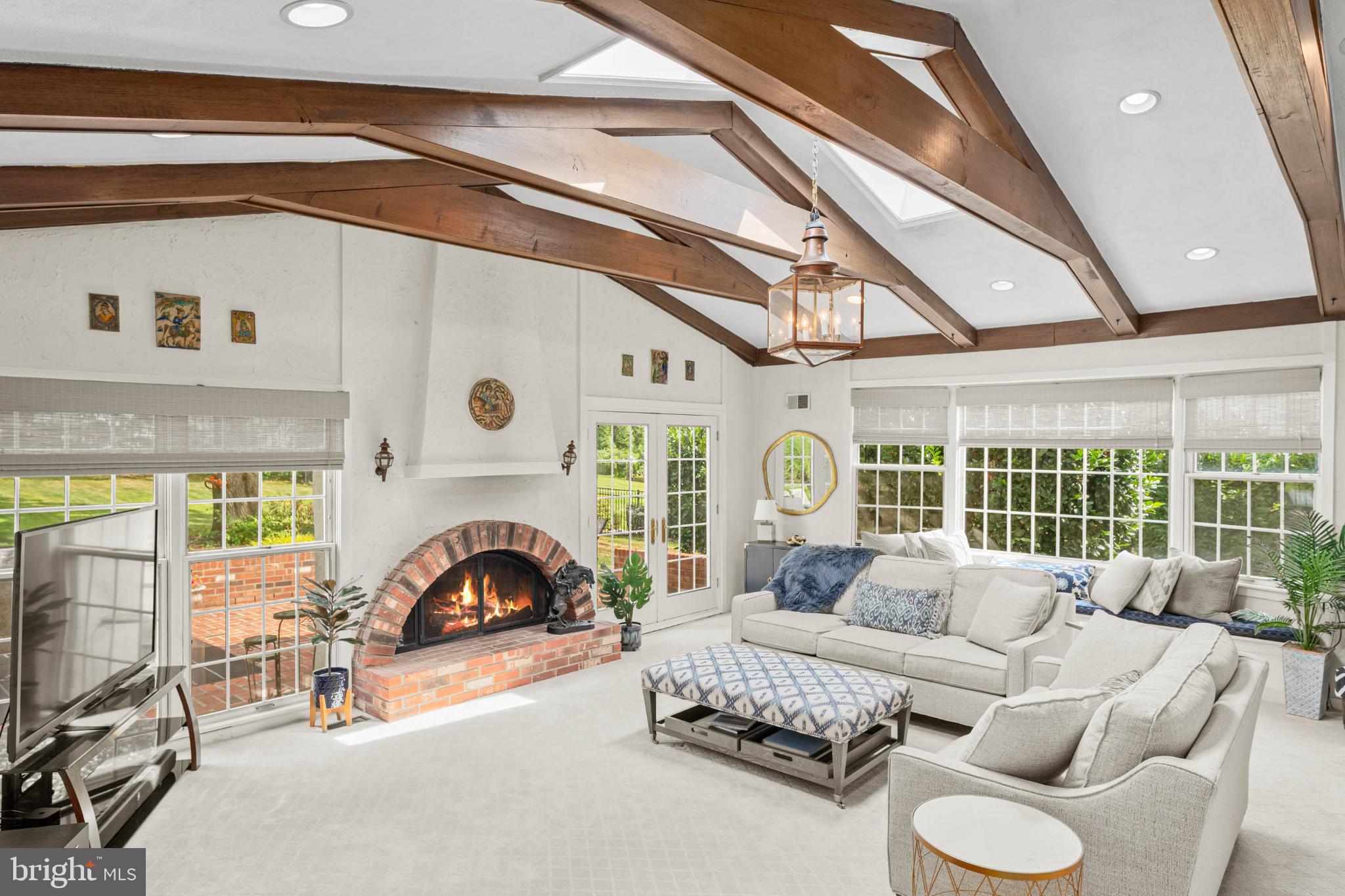 407 Fairview Road Penn Valley, PA 19072 - Photo 2 of 59 Spacious beamed family room with gas fireplace.