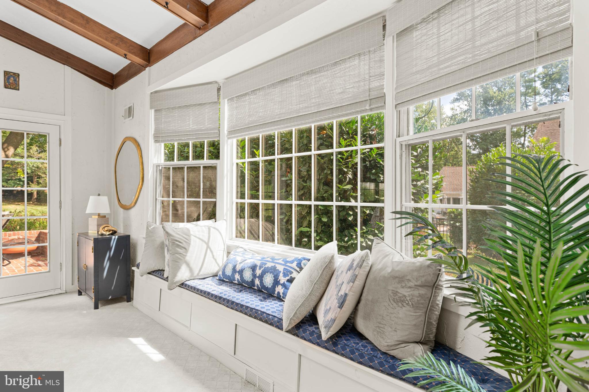 407 Fairview Road Penn Valley, PA 19072 - Photo 23 of 59 Sunlit family room retreat with lush garden views.