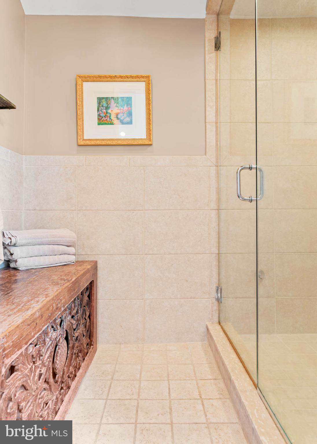 407 Fairview Road Penn Valley, PA 19072 - Photo 37 of 59 Main Bath w/steam shower & carved wood accents.