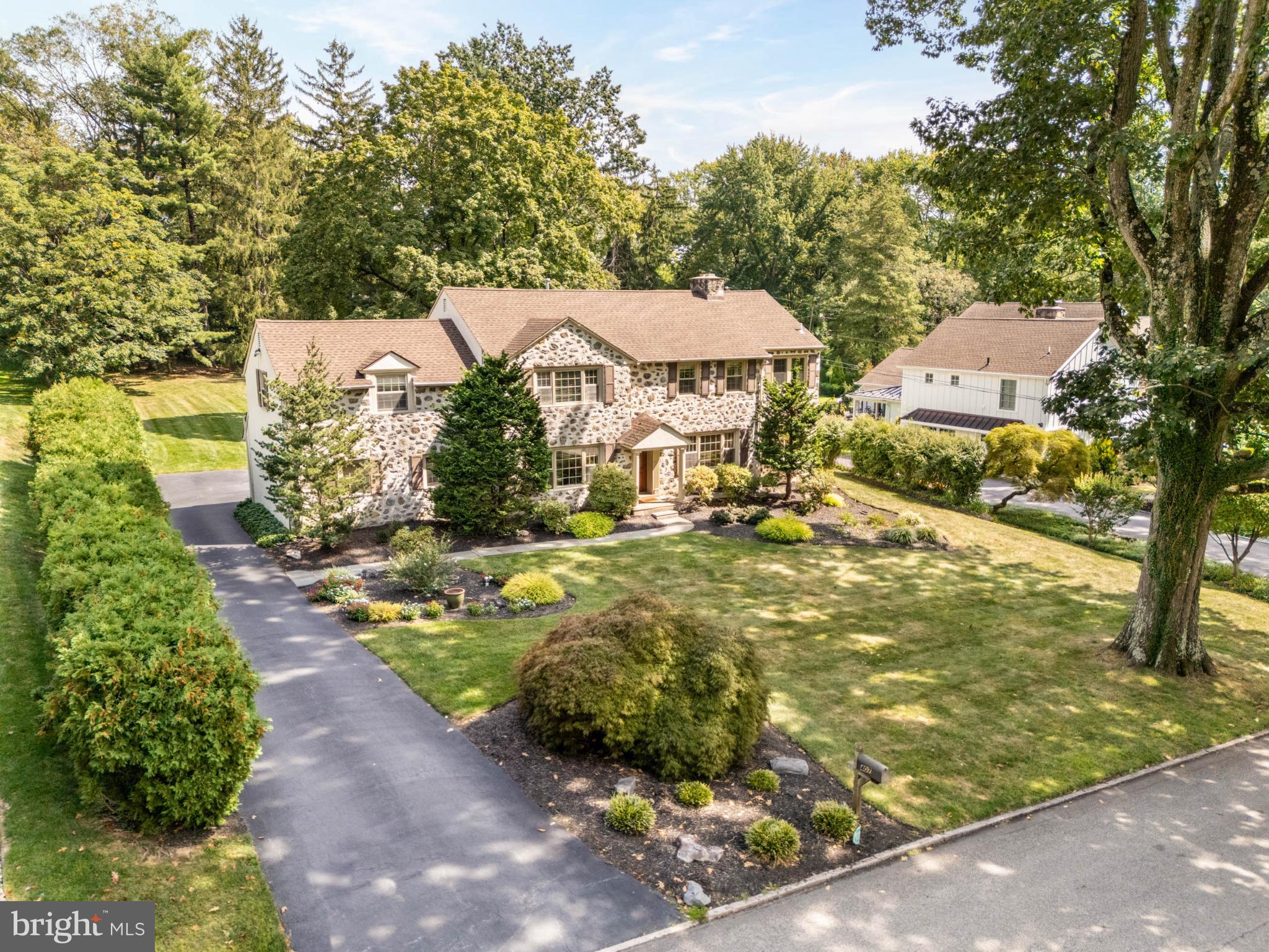 407 Fairview Road Penn Valley, PA 19072 - Photo 55 of 59 Fieldstone-front home showcasing Japanese maple.