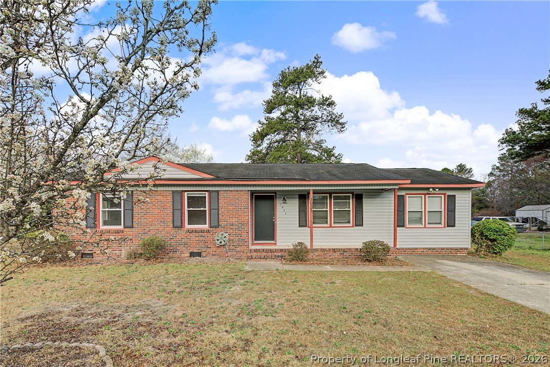 1931 Pumpkin Road Fayetteville, NC 28304 - Photo 1 of 48 front view of house with a yard