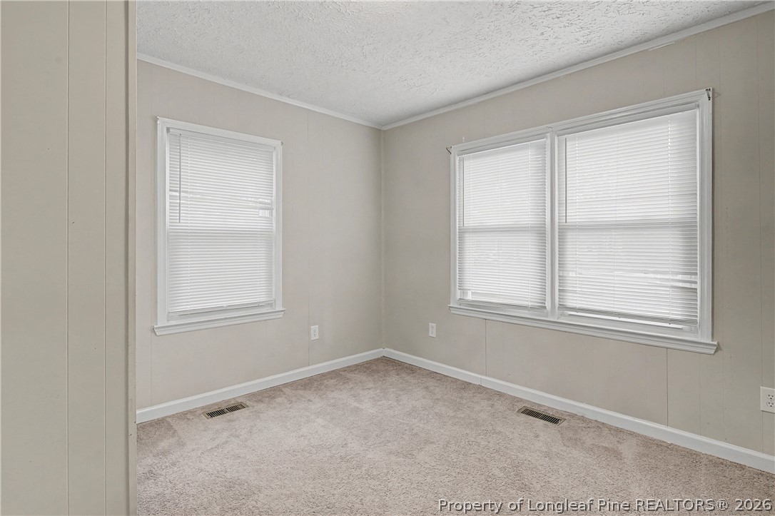 1931 Pumpkin Road Fayetteville, NC 28304 - Photo 11 of 48 an empty room with windows