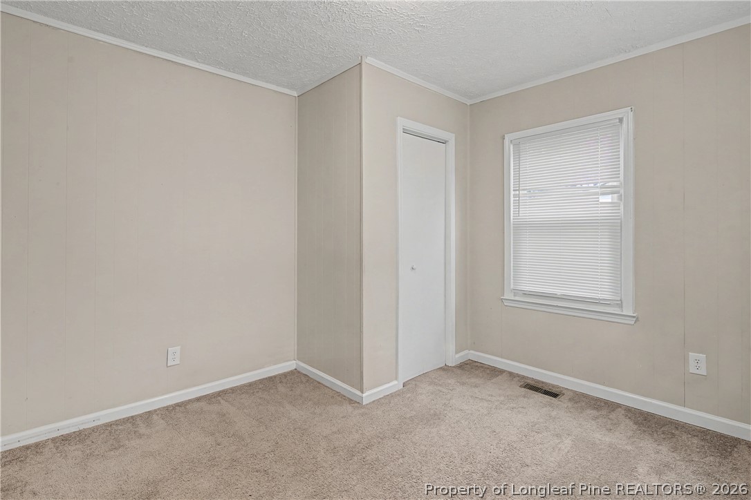 1931 Pumpkin Road Fayetteville, NC 28304 - Photo 14 of 48 a view of an empty room with a window