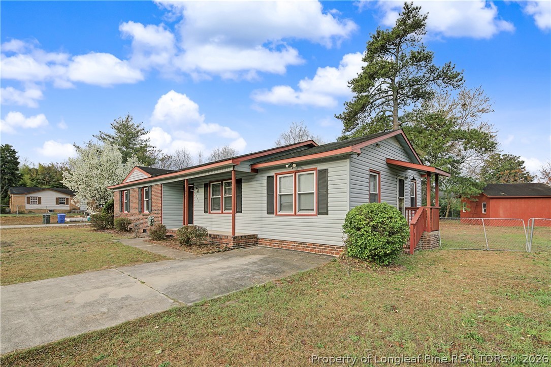 1931 Pumpkin Road Fayetteville, NC 28304 - Photo 2 of 48 a front view of house with yard and trees around