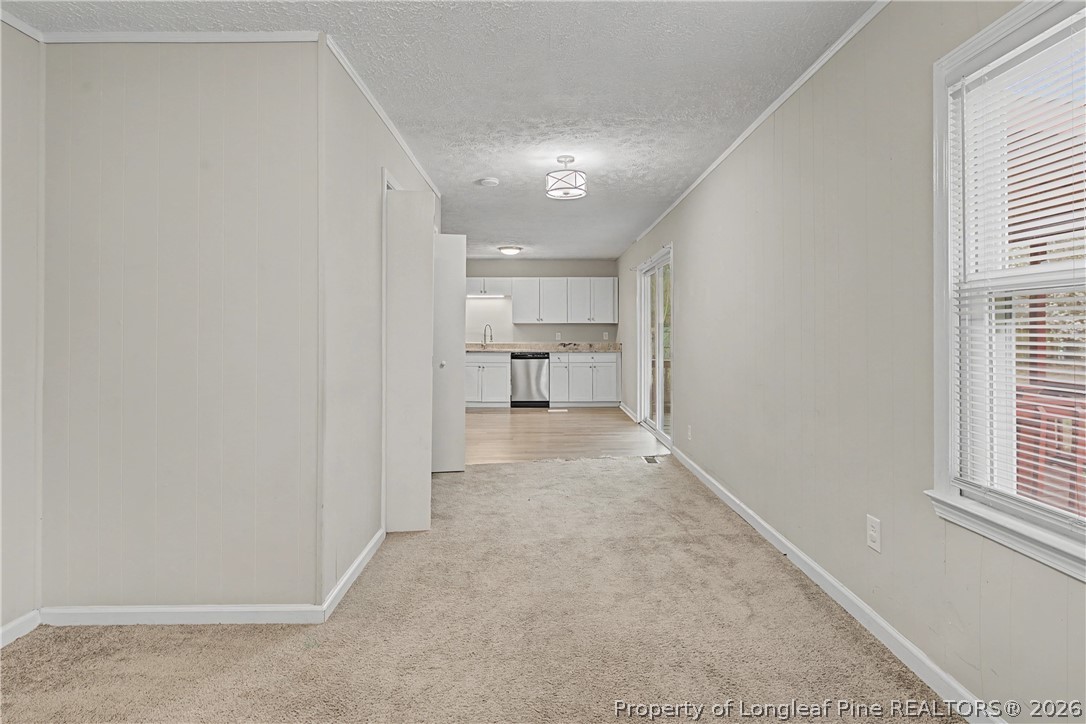 1931 Pumpkin Road Fayetteville, NC 28304 - Photo 23 of 48 a view of a hallway with a kitchen