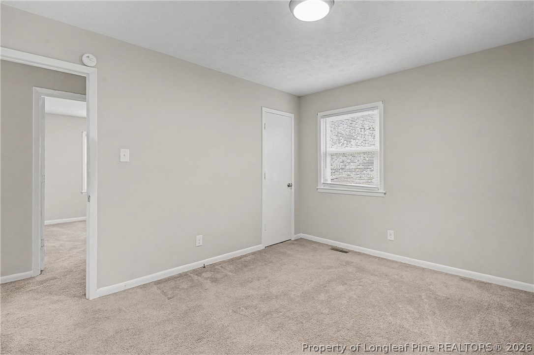 1931 Pumpkin Road Fayetteville, NC 28304 - Photo 28 of 48 an empty room with windows