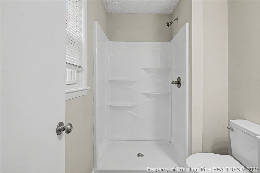 1931 Pumpkin Road Fayetteville, NC 28304 - Photo 29 of 48 a bathroom with a shower and toilet