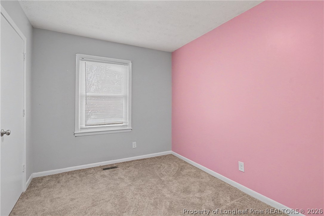1931 Pumpkin Road Fayetteville, NC 28304 - Photo 31 of 48 an empty room with windows