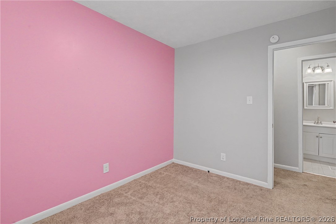 1931 Pumpkin Road Fayetteville, NC 28304 - Photo 32 of 48 an empty room with windows
