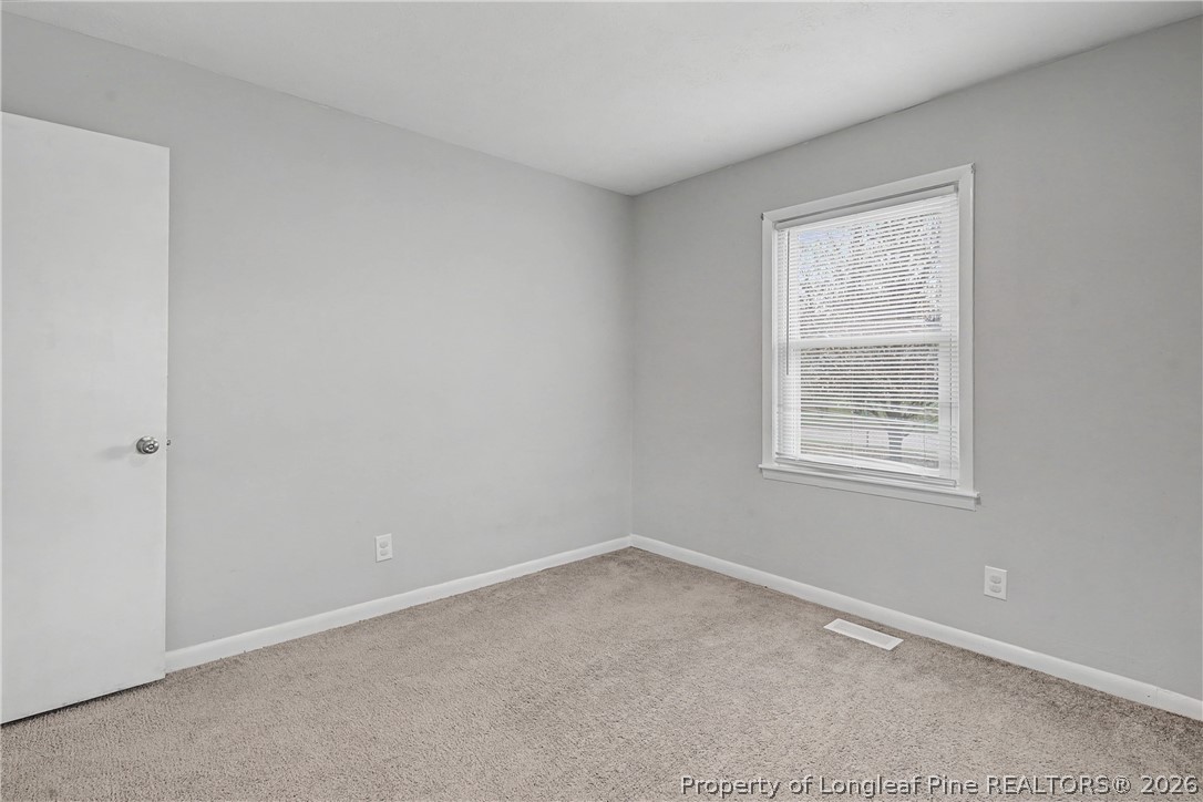 1931 Pumpkin Road Fayetteville, NC 28304 - Photo 40 of 48 an empty room with a window
