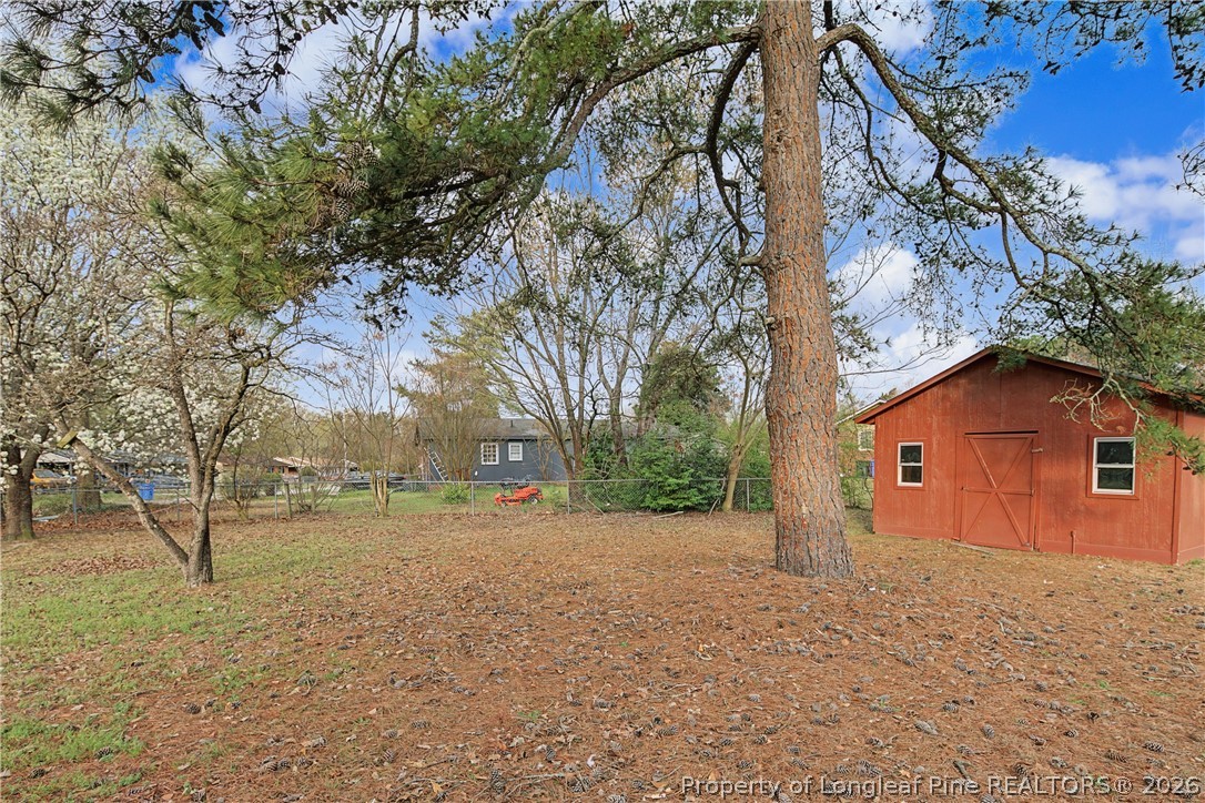 1931 Pumpkin Road Fayetteville, NC 28304 - Photo 45 of 48 a view of a yard with a tree