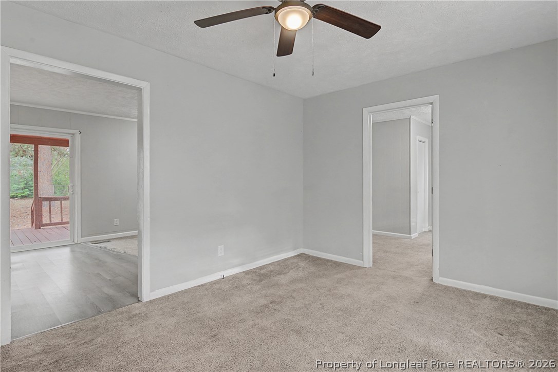 1931 Pumpkin Road Fayetteville, NC 28304 - Photo 6 of 48 an empty room with fan