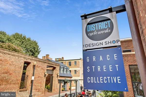 a view of a brick building with a door and a window