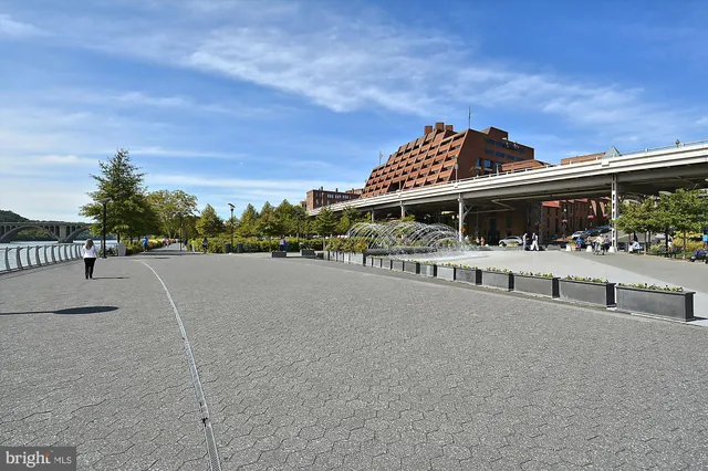 a view of a brick building with many windows