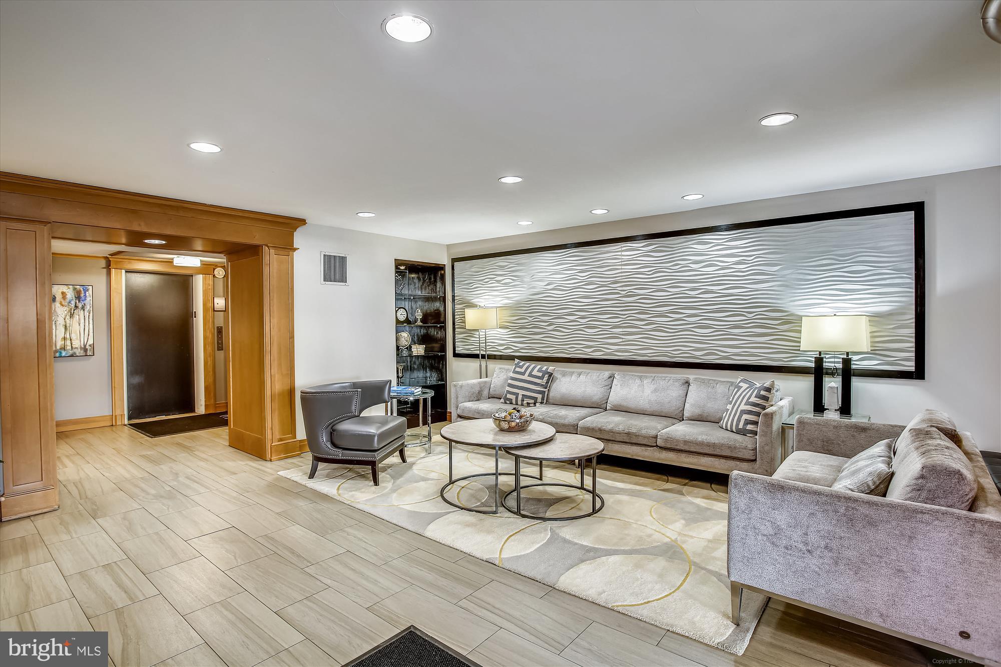 3900 Tunlaw Road Northwest, Unit 118 Washington, DC 20007 - Photo 47 of 58 a living room with furniture