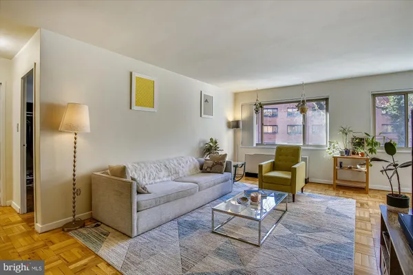 a living room with furniture and a rug