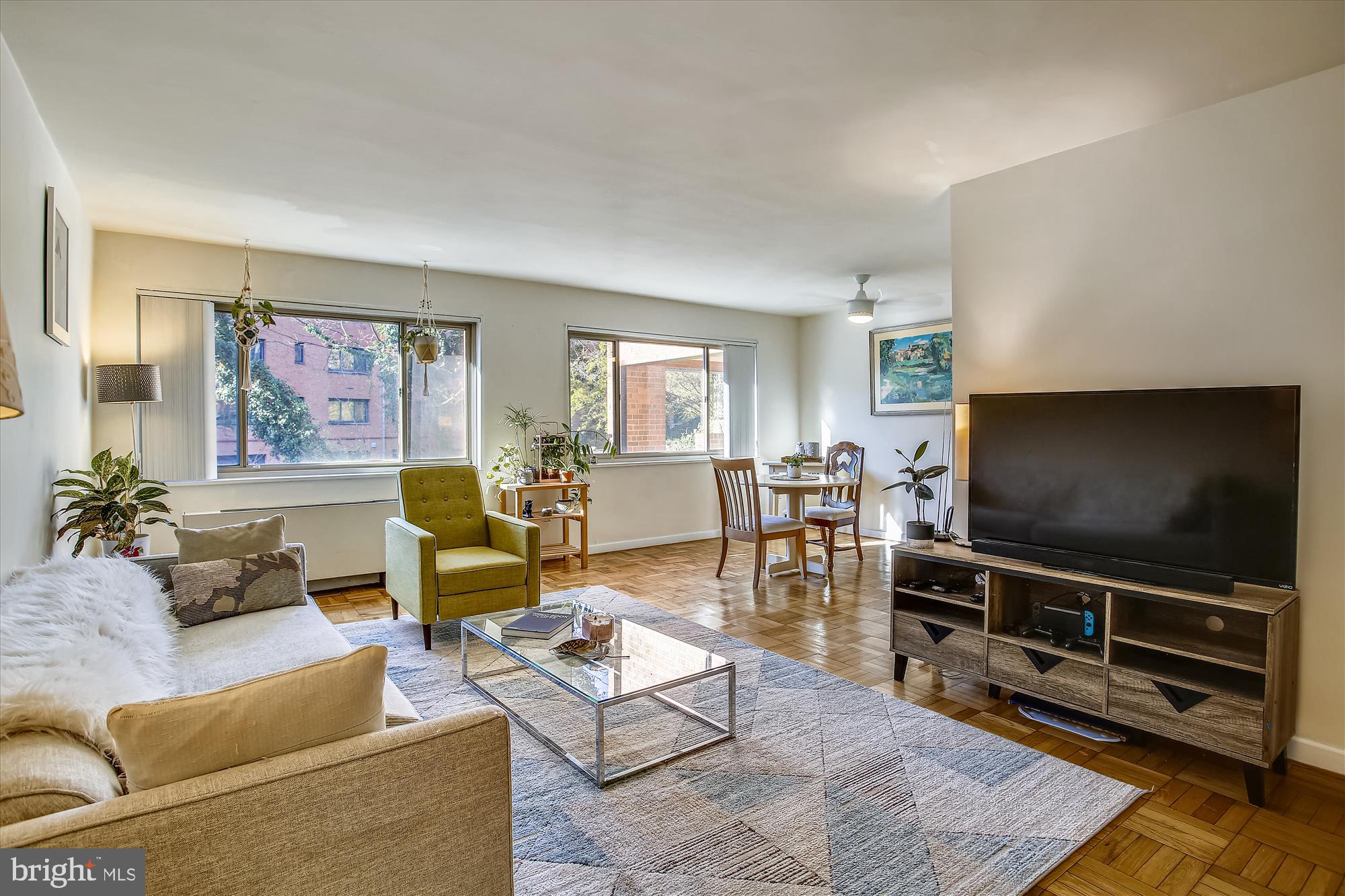 3900 Tunlaw Road Northwest, Unit 118 Washington, DC 20007 - Photo 6 of 58 a living room with furniture and a flat screen tv