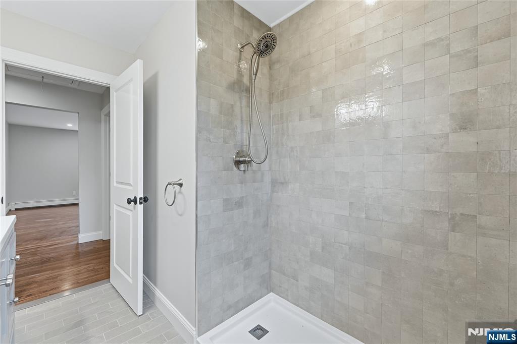 75 Colgate Avenue, Unit 2 Paramus, NJ 07652 - Photo 15 of 24 a bathroom with a shower