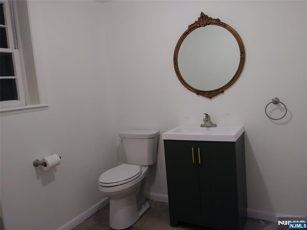 75 Colgate Avenue, Unit 2 Paramus, NJ 07652 - Photo 17 of 24 a bathroom with a toilet and a sink