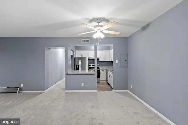a view of a kitchen with cabinet and a window