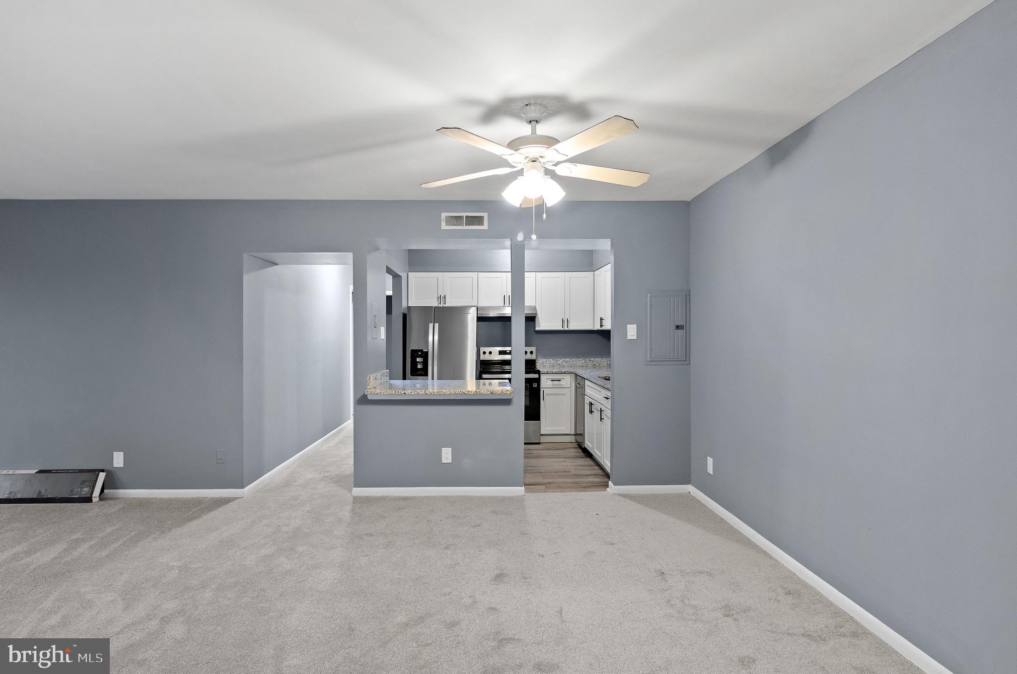 10121 Prince Place, Unit 30110B Upper Marlboro, MD 20774 - Photo 6 of 29 a view of a kitchen with cabinet and a window