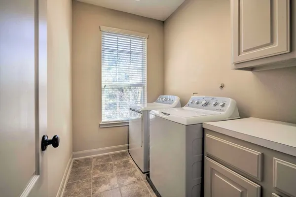 a utility room with dryer and washer
