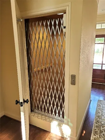 a view of a door with wooden floor