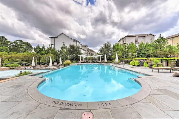 a view of a swimming pool with a garden