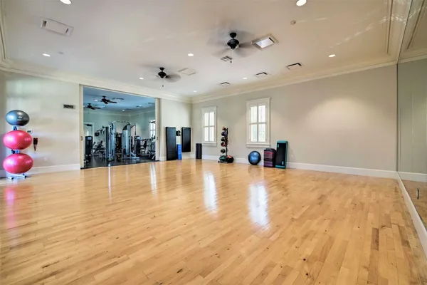 a view of a entryway room and hall with wooden floor