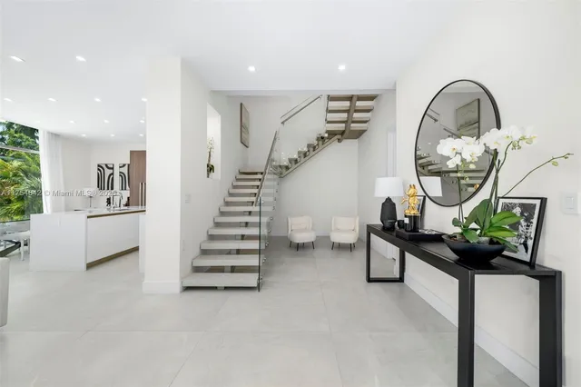 a view of swimming pool with outdoor seating and plants