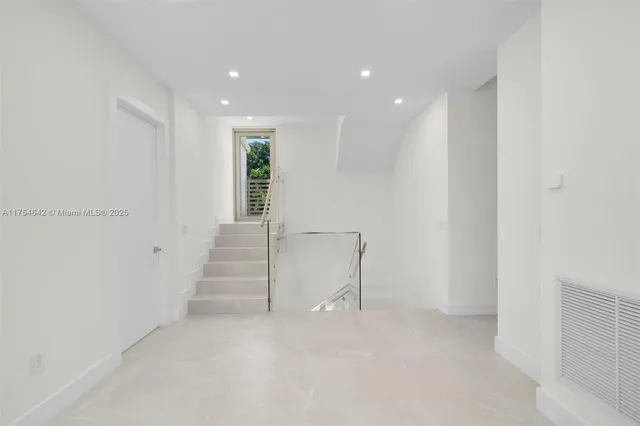 a view of a house with swimming pool and sitting area