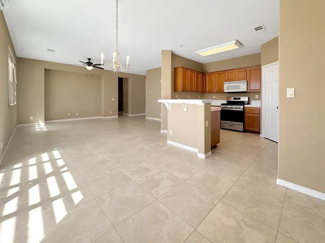 a view of a kitchen with a sink and cabinets