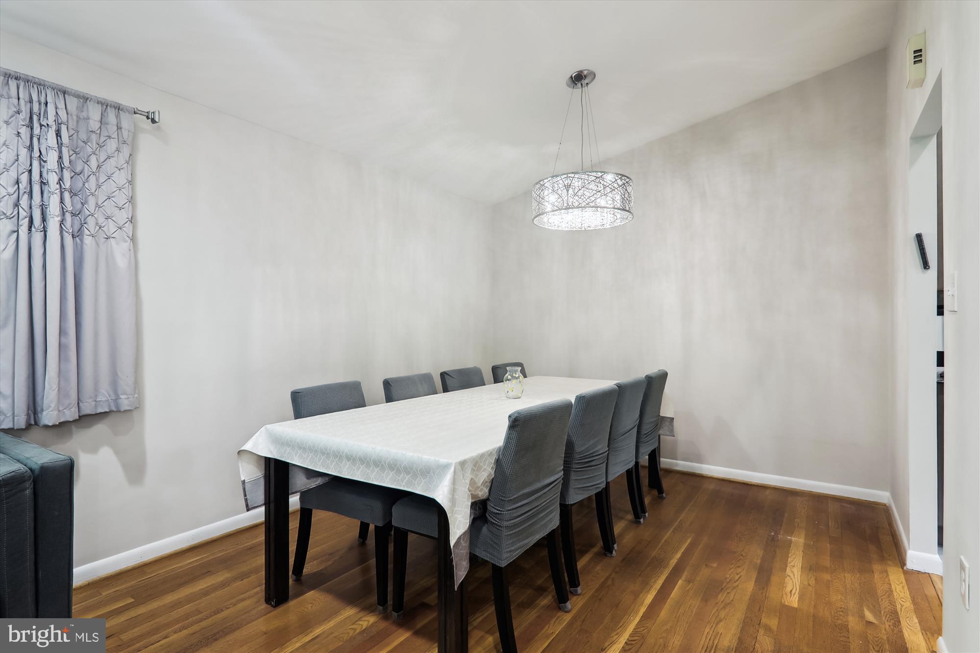 11804 Lovejoy Street Silver Spring, MD 20902 - Photo 11 of 45 a view of a dining room with furniture and wooden floor