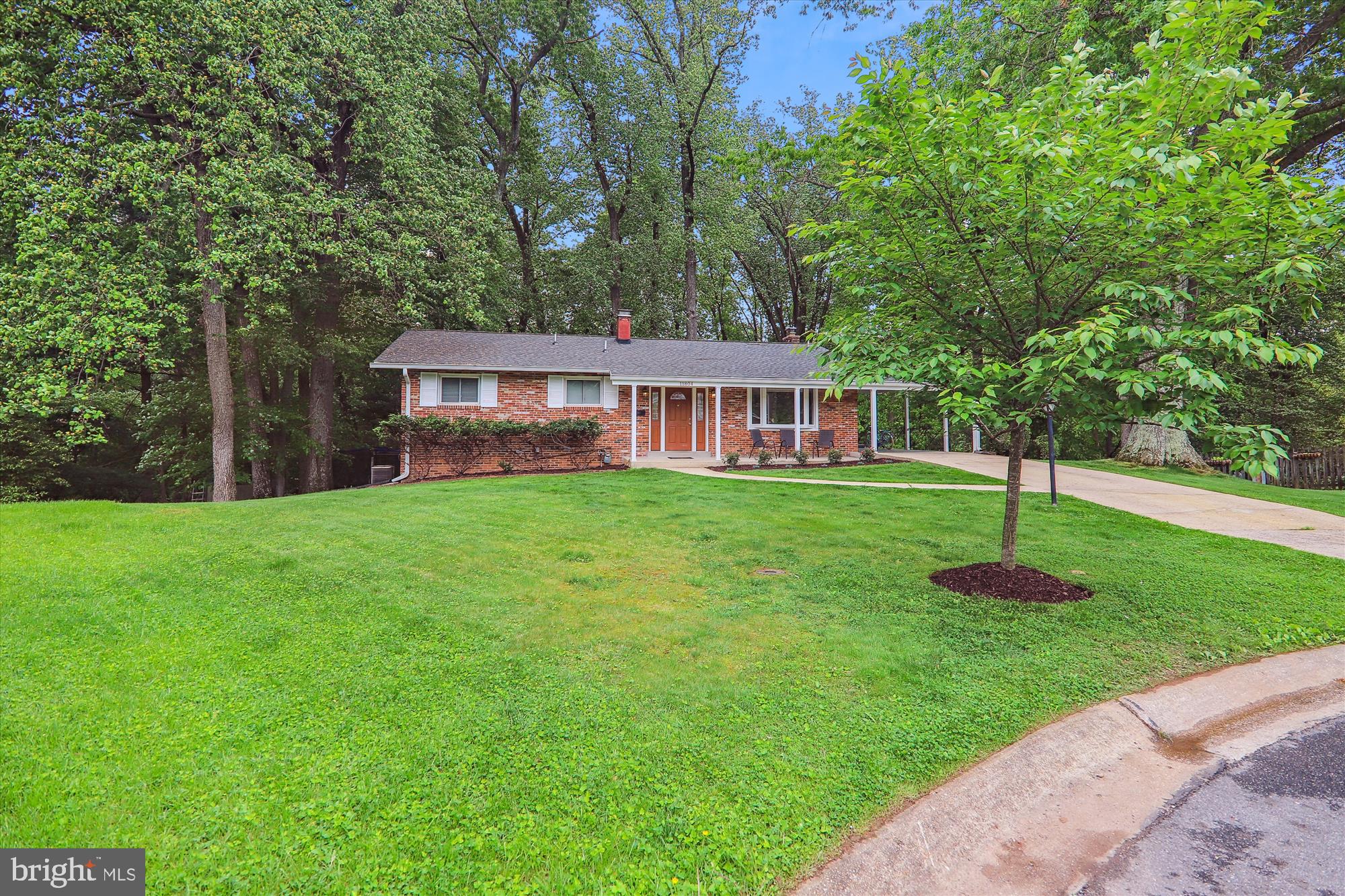 11804 Lovejoy Street Silver Spring, MD 20902 - Photo 2 of 45 a front view of a house with a garden