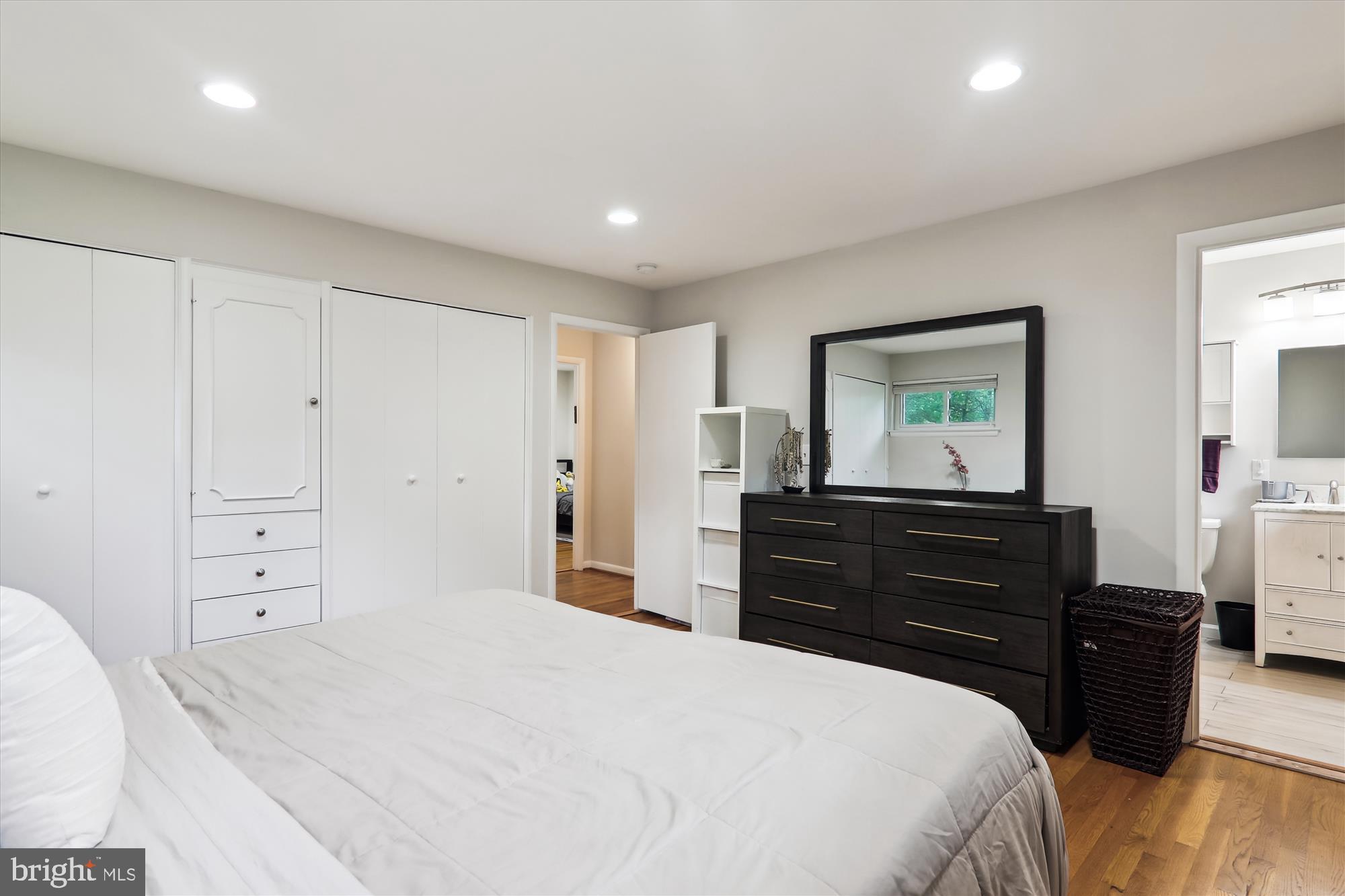 11804 Lovejoy Street Silver Spring, MD 20902 - Photo 24 of 45 a bedroom with a bed and a dresser