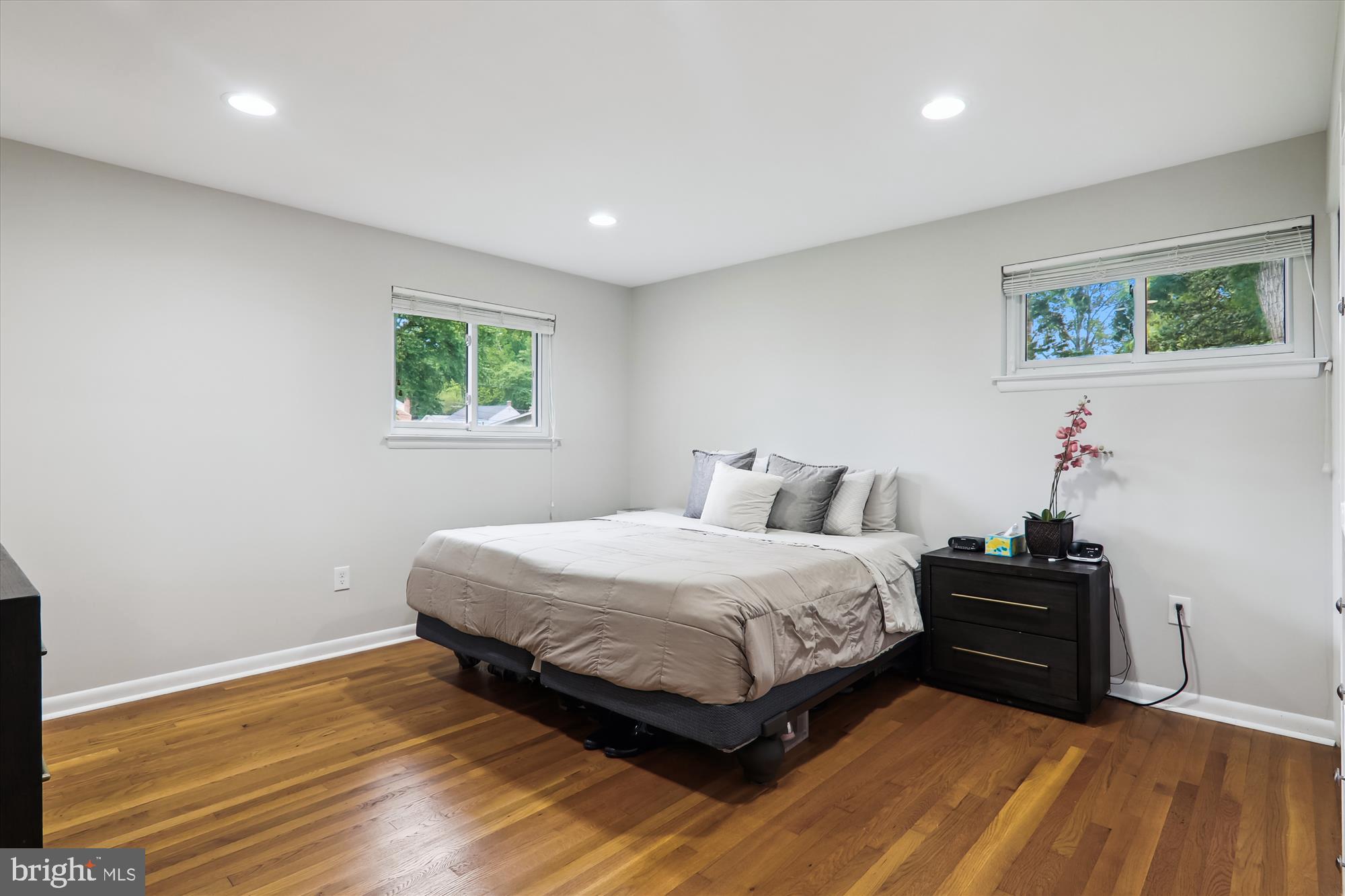 11804 Lovejoy Street Silver Spring, MD 20902 - Photo 25 of 45 a bedroom with a bed and wooden floor
