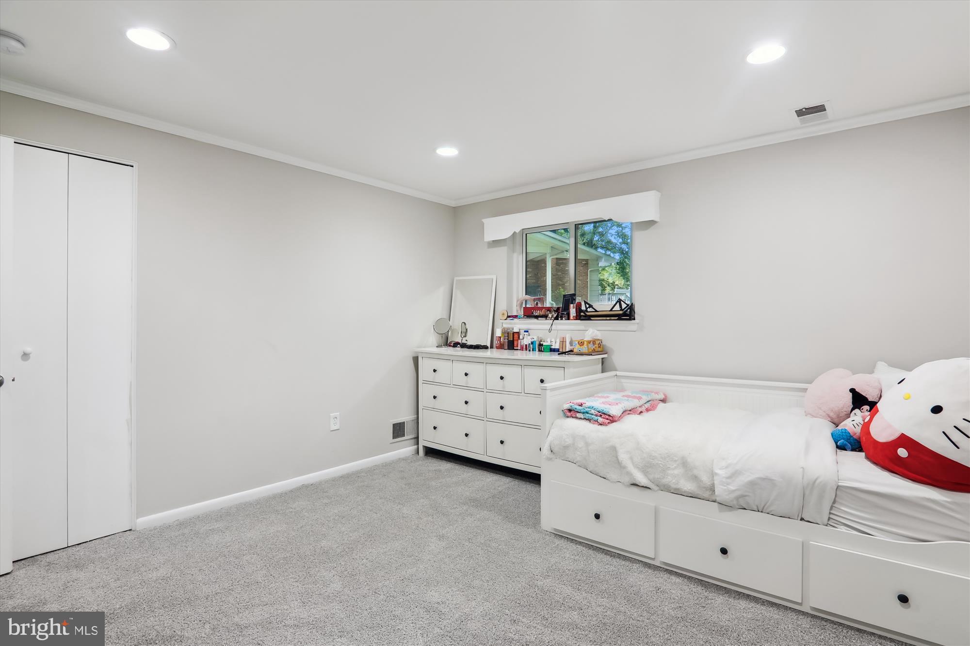 11804 Lovejoy Street Silver Spring, MD 20902 - Photo 29 of 45 a room with a bed and a dresser