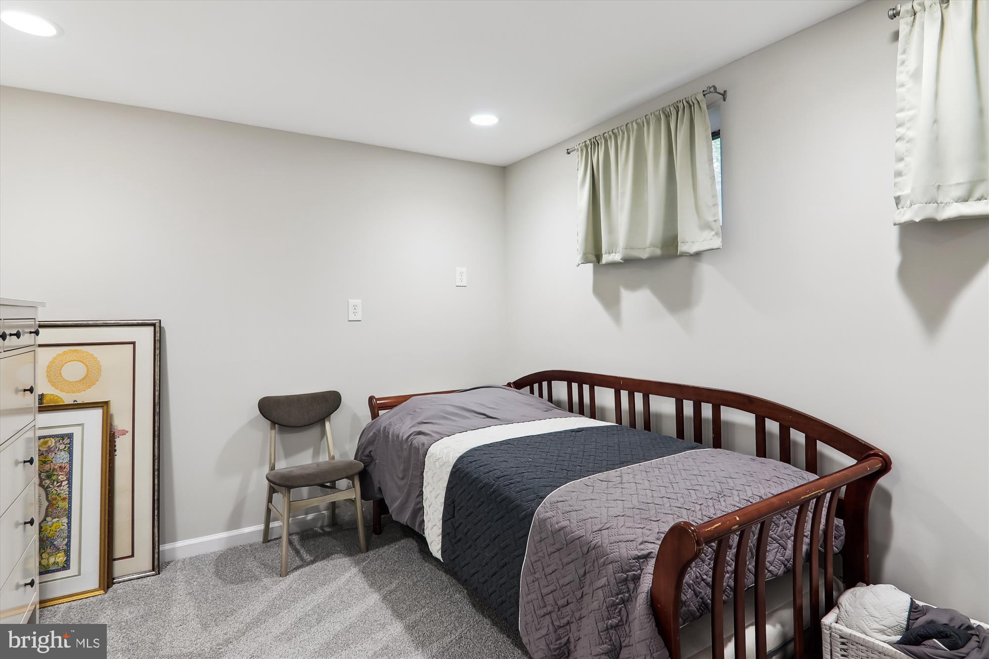 11804 Lovejoy Street Silver Spring, MD 20902 - Photo 31 of 45 a bedroom with a bed and a window