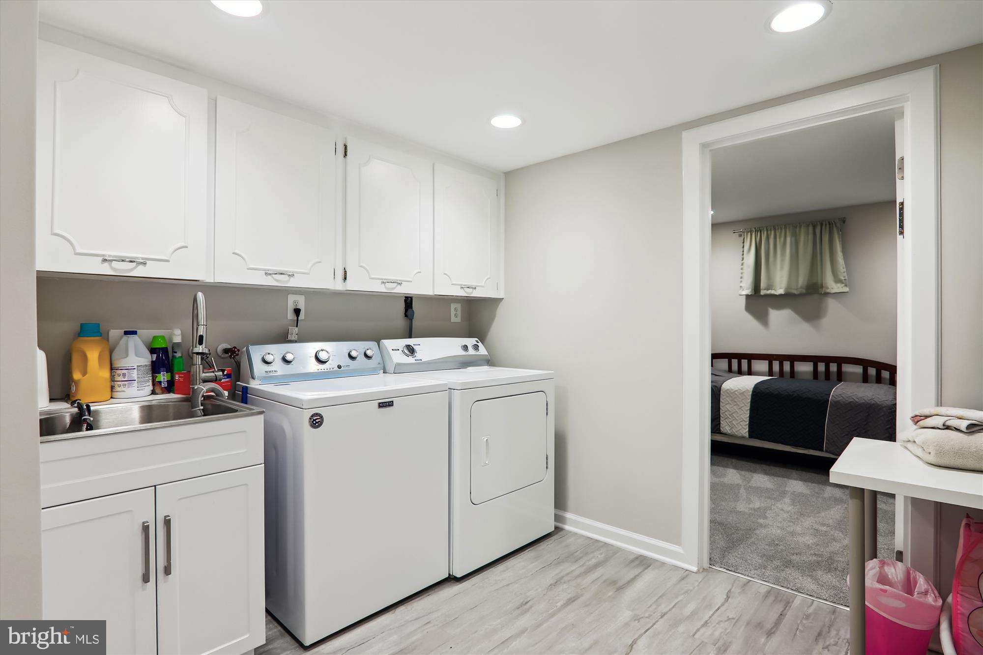 11804 Lovejoy Street Silver Spring, MD 20902 - Photo 33 of 45 a utility room with sink dryer and washer